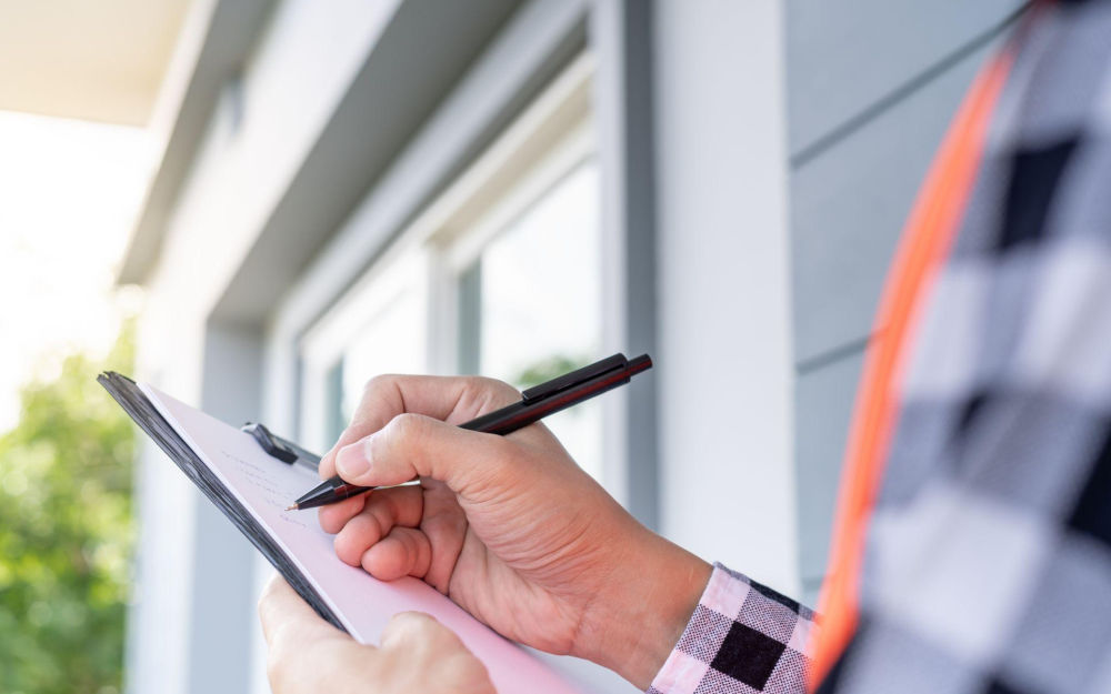 Written quote for window replacement Contractor writing a window replacement quote