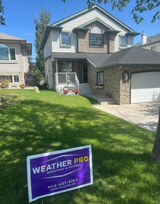What the Leduc Climate Does to a Window | Weather Pro Residential home in Leduc with Weather Pro windows and doors sign