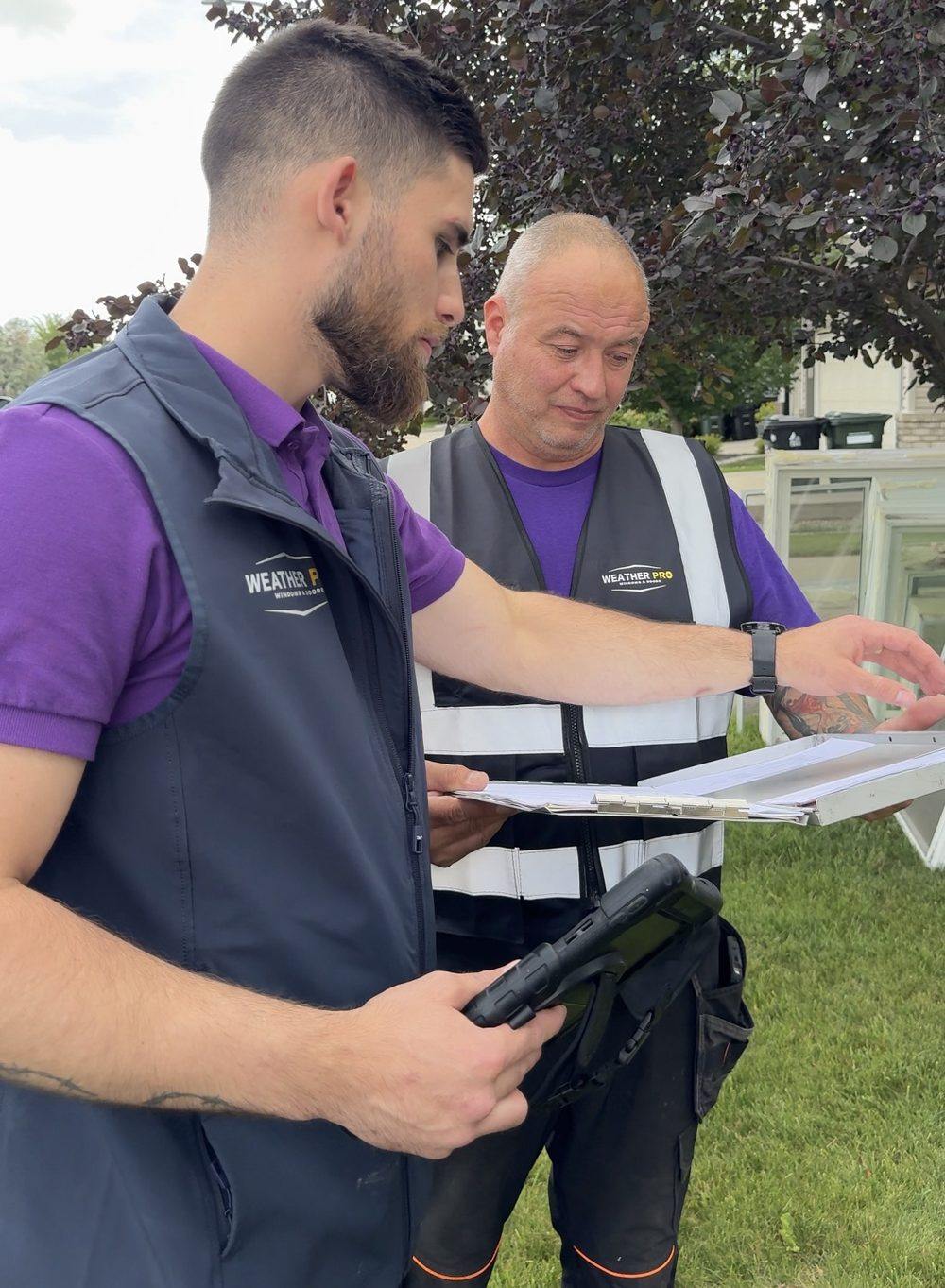 Professional Window and Door Installation in Calgary Weather Pro installation crew reviewing a project on site in Calgary