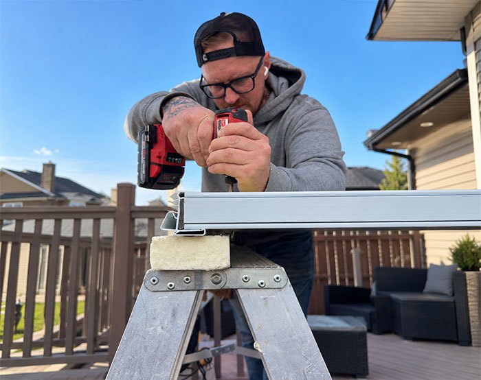 Weather Pro window installer Weather Pro installer assembling a window frame on site in Calgary