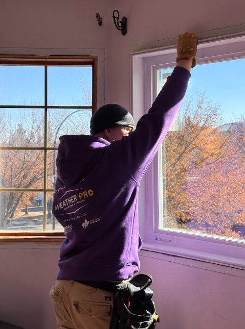 Window Installation in Red Deer | Weather Pro Weather Pro technician installing a replacement window in Red Deer